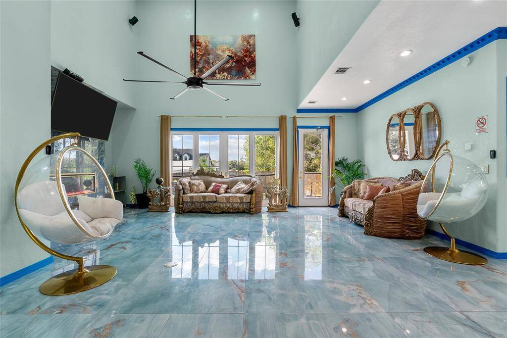 Open living area w/sliding doors to pool area, and high ceilings off complete tranquility and comfort.
