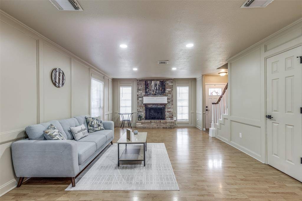 This view from the living room captures the gas log fireplace and a storage closet to the right.