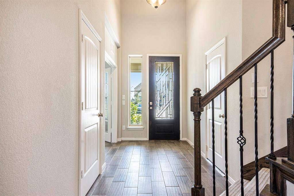 Right of the entrance way is a study with glass lite French doors, perfect for working from home or some extra space for work or play!