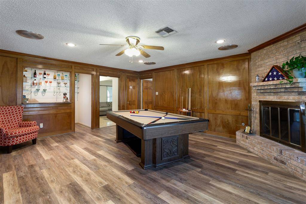 Looking back toward entry, you can see the corner fireplace and bar in background.
