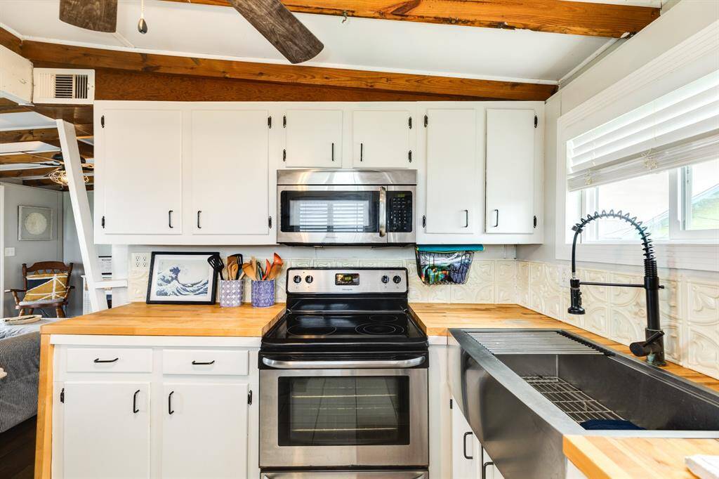 A large microwave and range complete this kitchen.