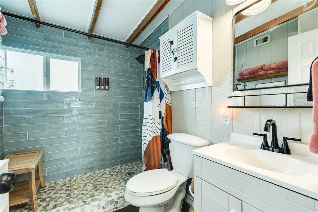 This light and bright bathroom has a fresh new shower and lots of natural light.