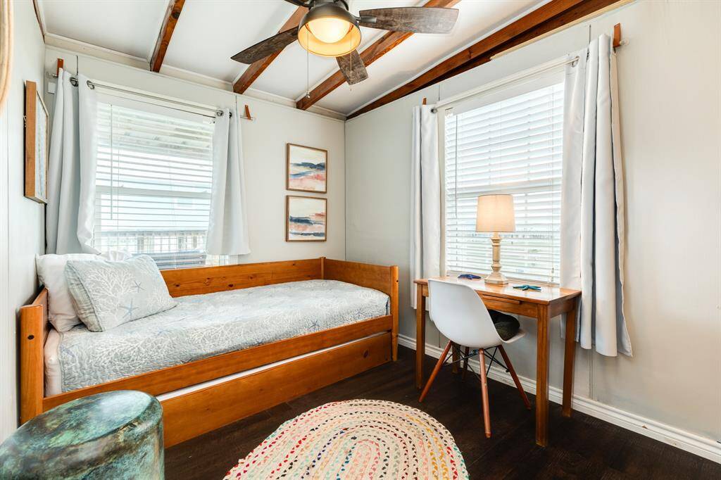 With 2 separate bedrooms, this home will easily accommodate 4 with this trundle bed or serve as a home away from home office.