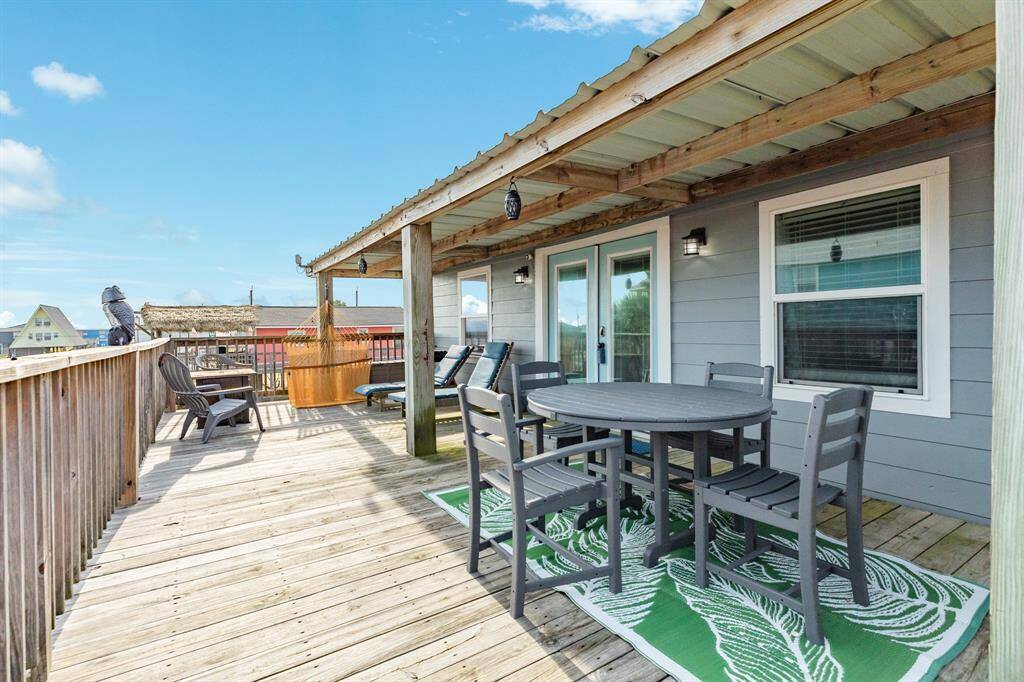 Up top - this deck provides gulf views and lots of shade.  There is a firepit and grill as well.
