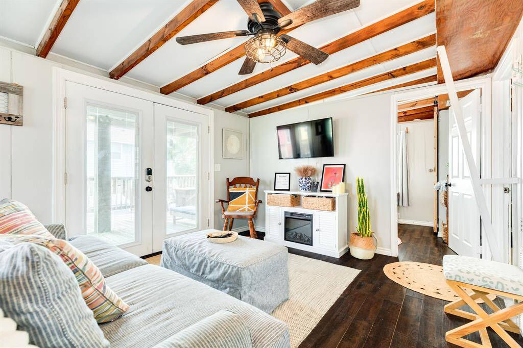 A view of the TV and electric fireplace gives you a view from the kitchen.