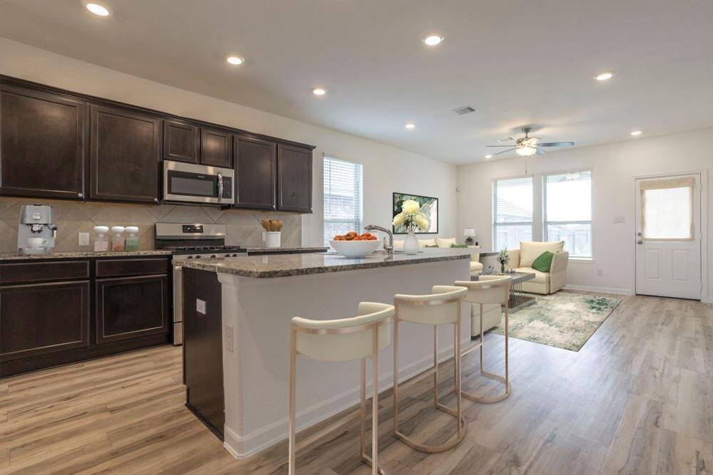 STAGED: Island in this eat in kitchen with breakfast bar