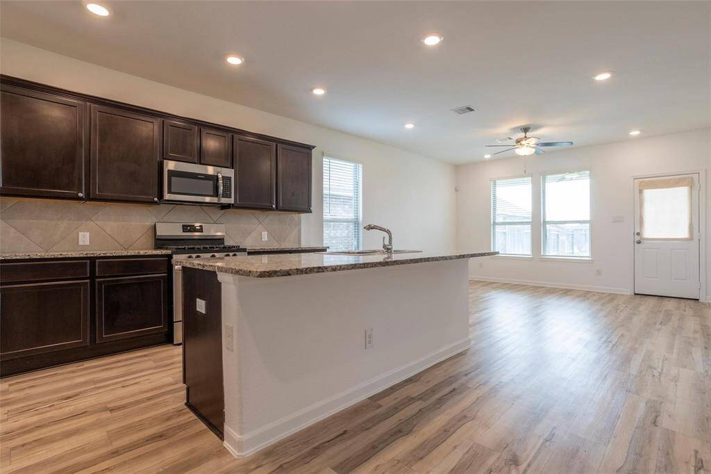 Wood looking, durable vinyl flooring throughout the common areas.