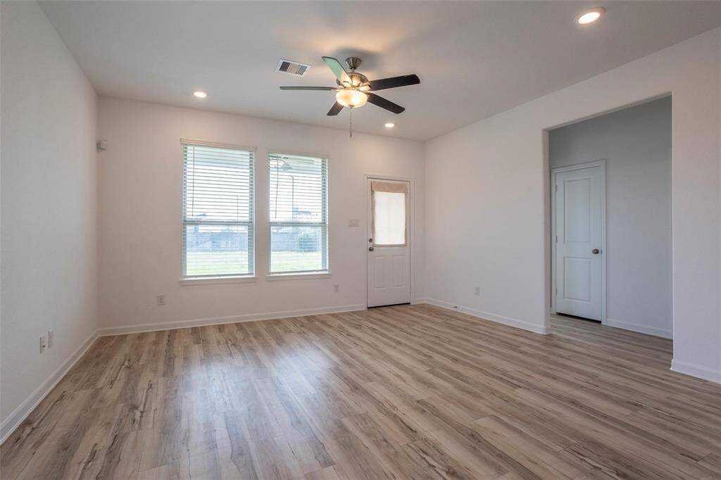 Living room opens to the back yard and covered back porch that extends the entertainment space to the outdoors.