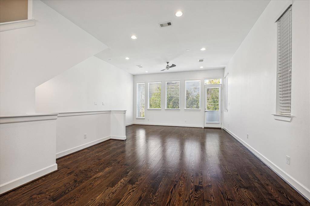 Located on the 2nd floor, you will find the large open living area is flooded with natural lighting. You will also find hardwood flooring and high ceilings.