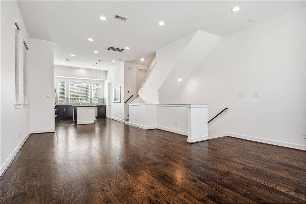 Another view of the living/dining areas, open to the kitchen. Great for entertaining!