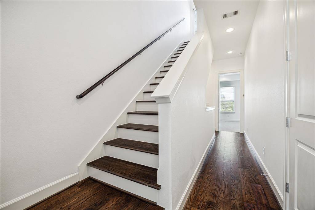 2nd floor hallway has access to the laundry closet, and stairs that lead up to the roof top terrace.