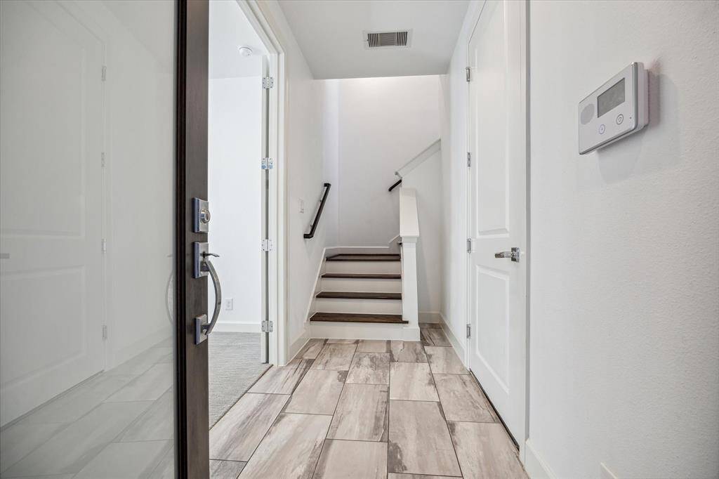 Tiled first floor entry that can be accessed from the garage and the front door.