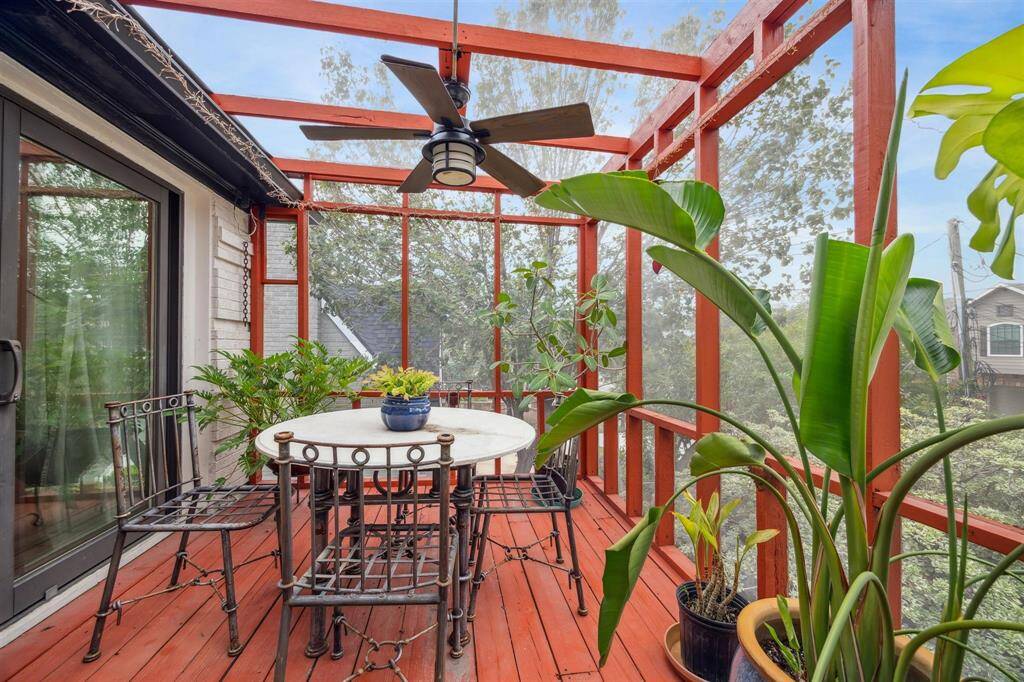 Upstairs screen porch nestled in the trees