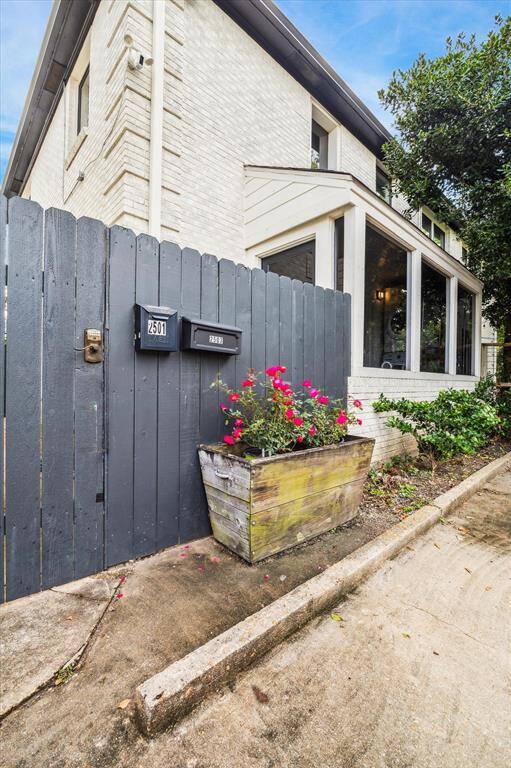 Side gate to duplex mudroom and downstairs garage studio #1.  off-street parking (5 spaces)