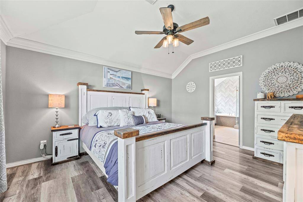 Relax and recharge in this inviting owner's retreat with soft neutral finishes including updated flooring and ample space for your California King and other large furnishings.
