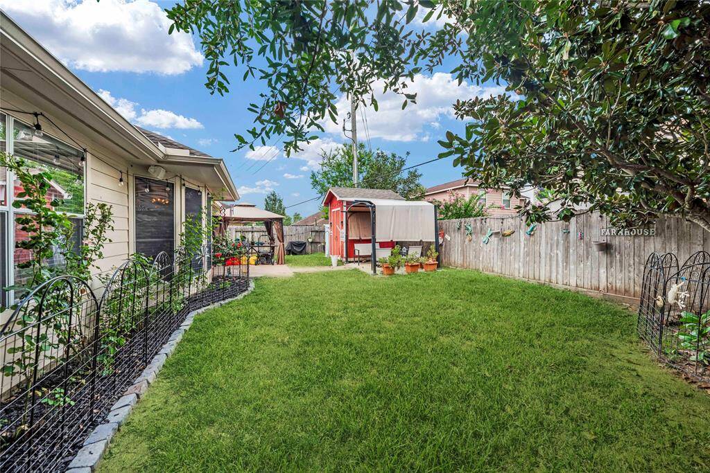 Mature flower beds, fenced side yards, a garden shed, and large patios provide a charming and functional outdoor space perfect for relaxation and entertaining. Mature flower beds and fenced side yards offers ample room for planting, while the cozy patio areas are ideal for dining al fresco or enjoying a morning coffee. The addition of the garden shed ensures plenty of storage for all your gardening tools and outdoor equipment, making this backyard a true gardener's paradise.