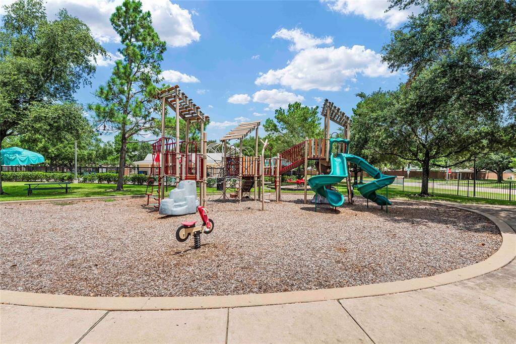 The neighborhood park, near this home, offers a delightful playground for children, complete with play structures and plenty of open space. With nearby picnic areas and shaded seating, it's the perfect spot for family outings and enjoying the outdoors.