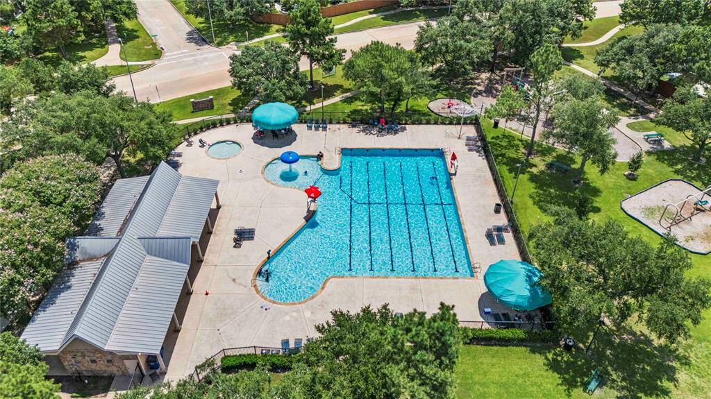 The neighborhood pool, conveniently located just steps from home, features a large swimming pool perfect for swimming laps or enjoying a leisurely dip. With additional amenities like a children's splash zone and shaded seating, it's an ideal spot to spend long lazy Saturdays.