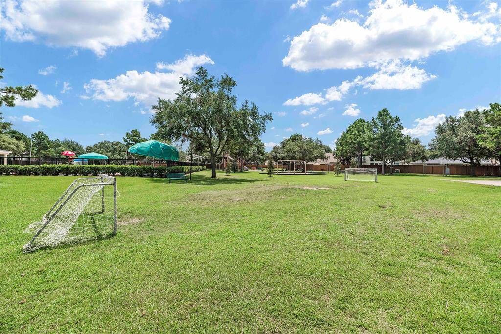 The community amenities include this practice field perfect for soccer, frisbee, and various outdoor activities.
