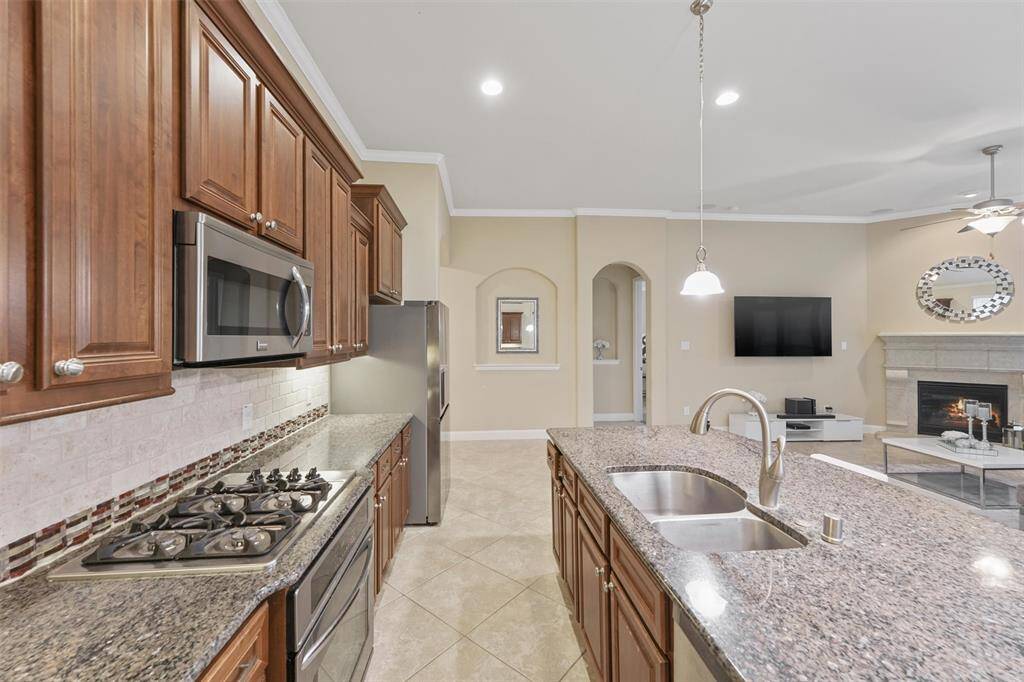 Perfect for families, this open-concept kitchen allows for easy interaction.