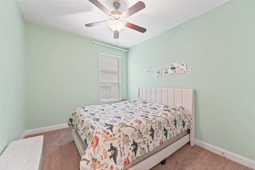 Soft green walls create a calming and inviting atmosphere.  Ideal for kids who love dinosaurs.