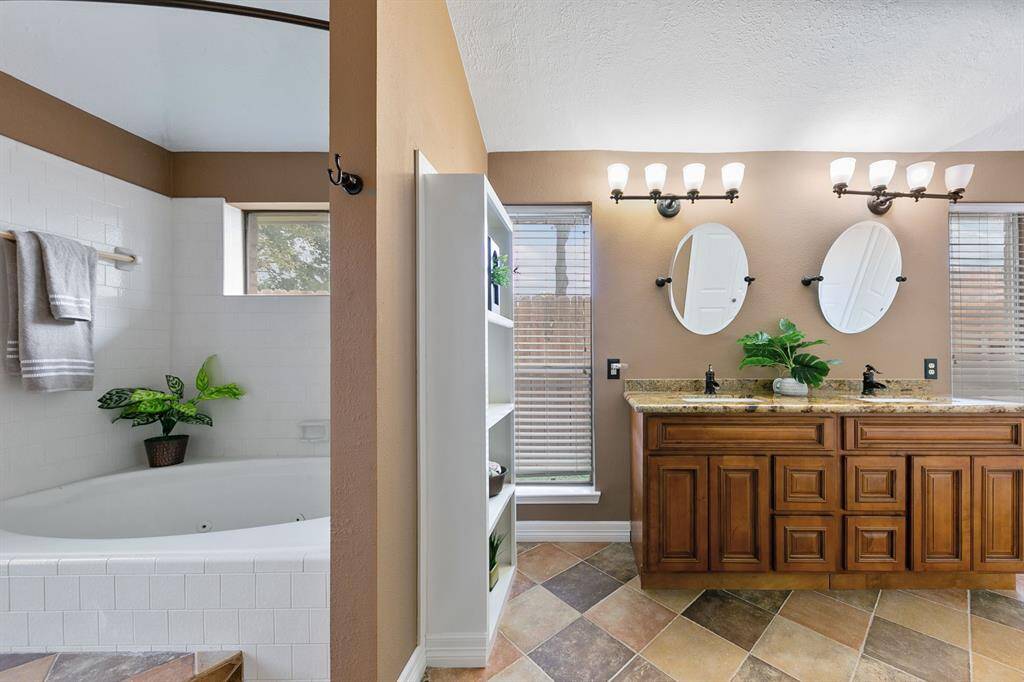 The primary ensuite is a luxurious retreat featuring dual sinks, a relaxing whirlpool tub. The space is designed with ample closet and storage options, ensuring convenience and organization.