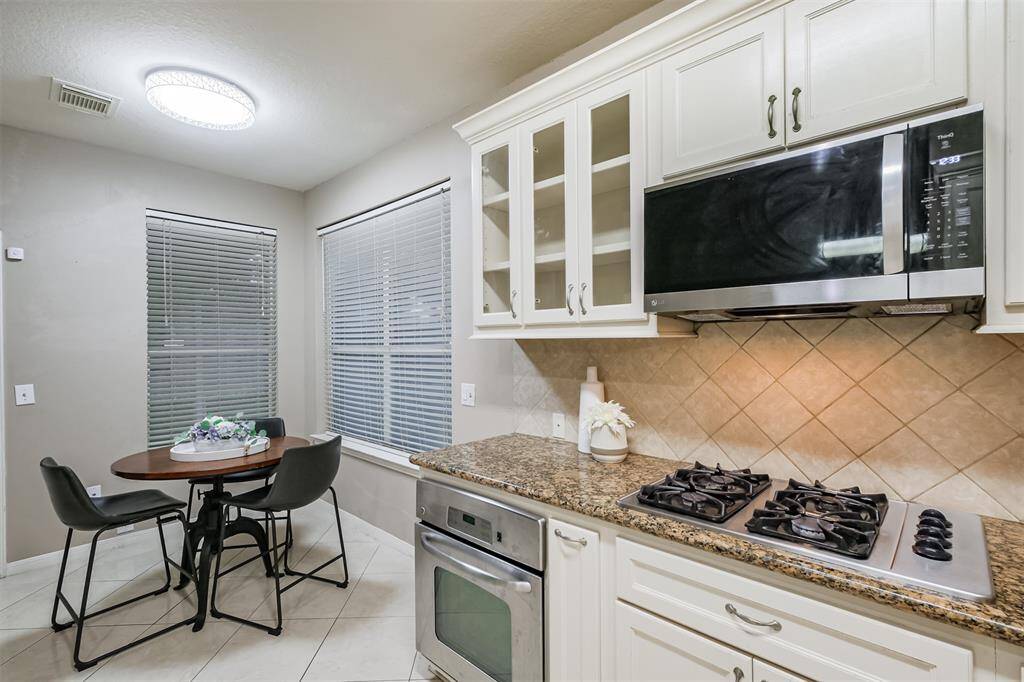 Breakfast room with large windows provide great natural light.