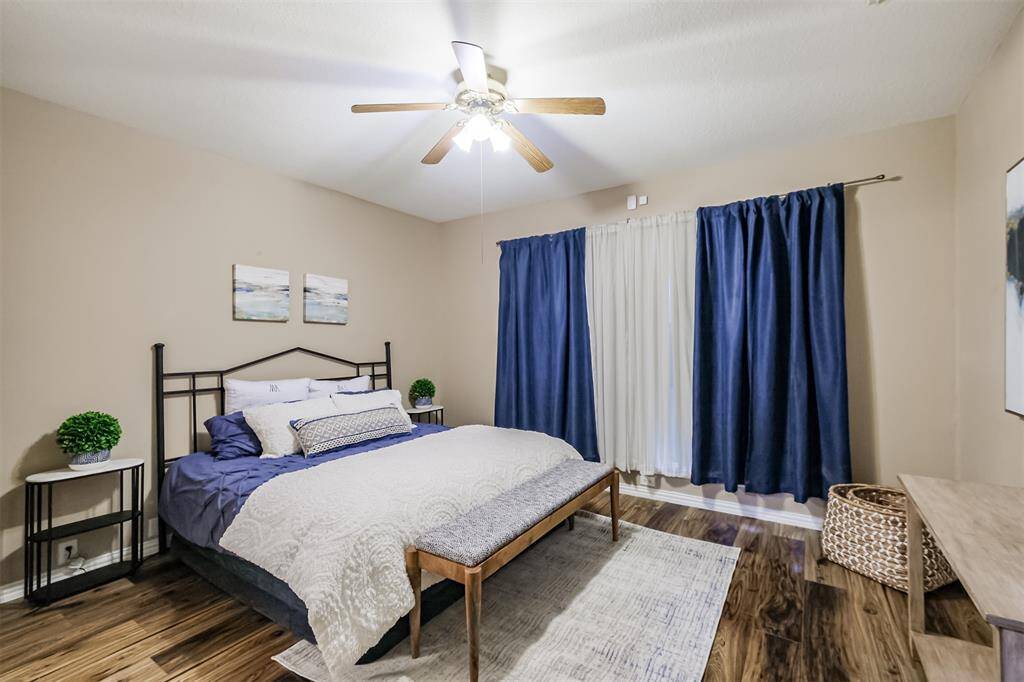 The Primary bedroom is located downstairs and has the same flooring as the living areas.