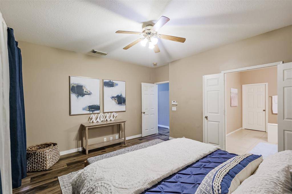 Primary with double doors to the large primary bathroom.