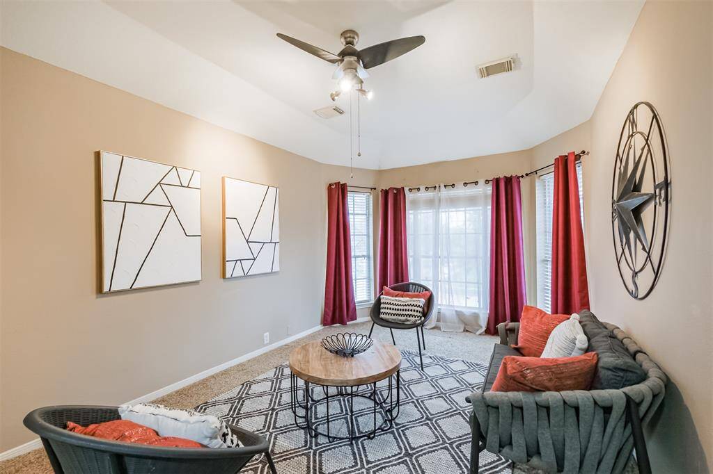 Upstairs game room with bay windows.
