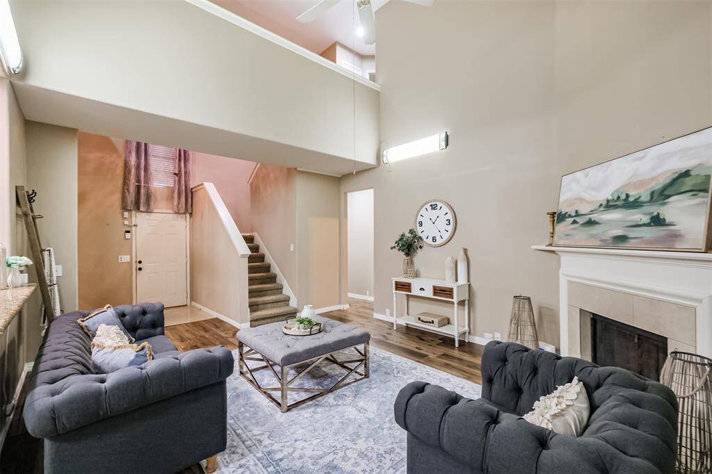 Use an entertainment center, or mount the TV over the fireplace.
