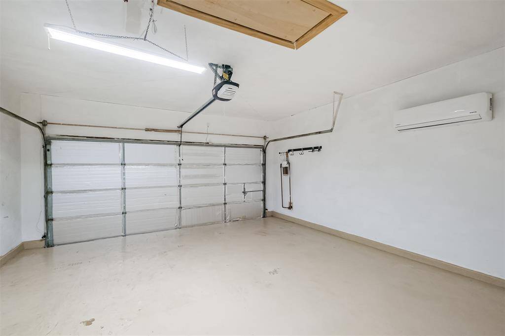 The garage has many upgrades including a AC wall unit for the garage, extra lighting, insulation, and attic storage space. Also note the home has a water filtration system.