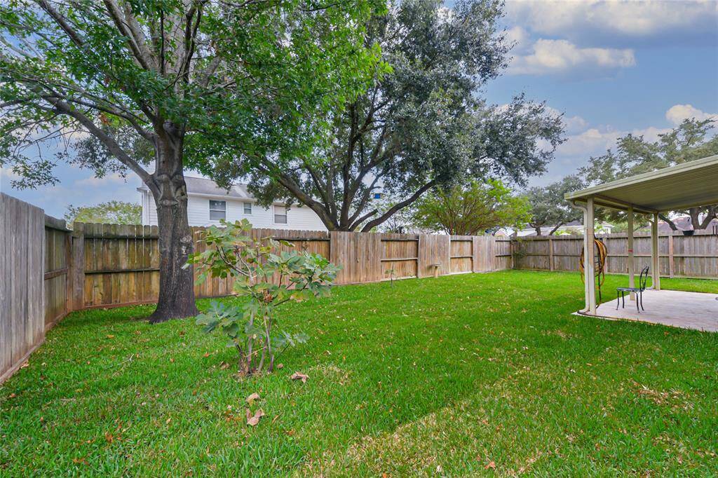 Spacious yard with mature and well maintained trees.
