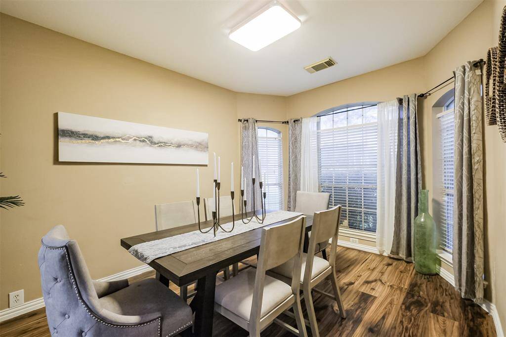 Stately home on a corner lot in the established neighborhood of Raintree Village in Katy Texas.