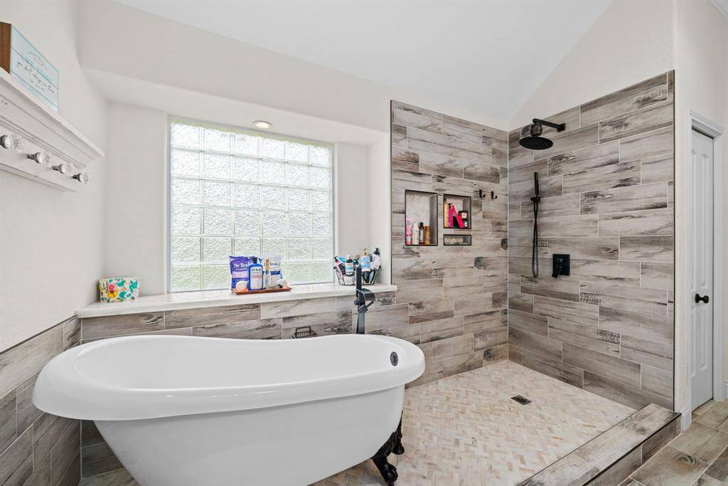 Beautiful updated bathroom with soaking tub and shower combo.