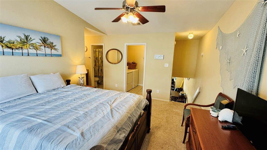 Spacious bedroom with balcony.
