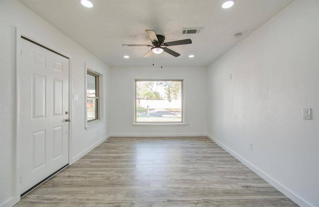 Bright open-concept living room with modern design and ample natural light.