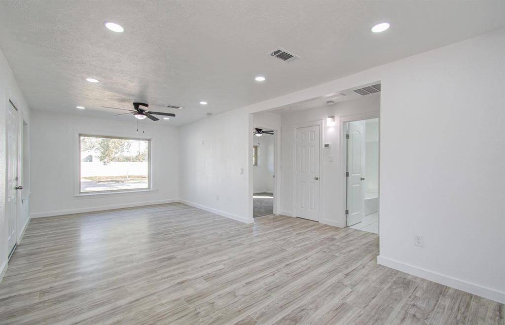 Bright open-concept living room with modern design and ample natural light.