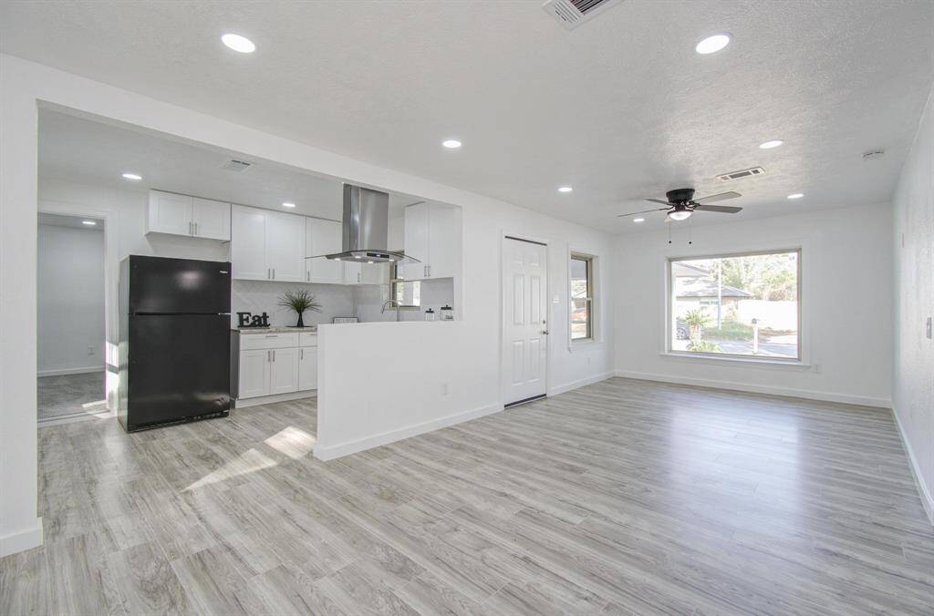 Modern kitchen with sleek countertops, ample storage, and contemporary finishes