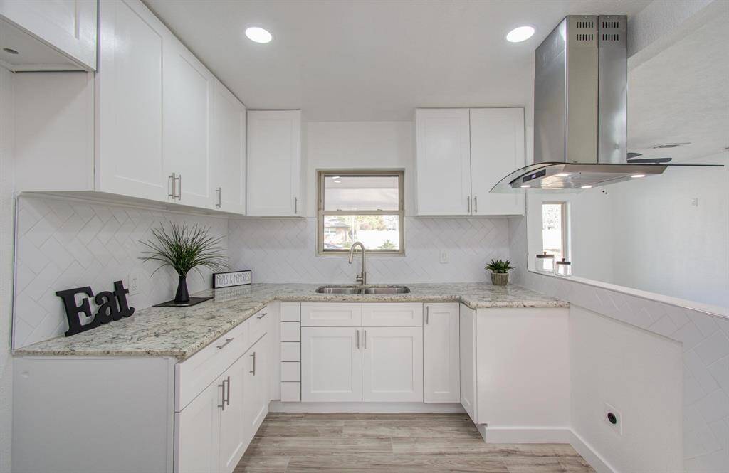 Modern kitchen with sleek countertops, ample storage, and contemporary finishes
