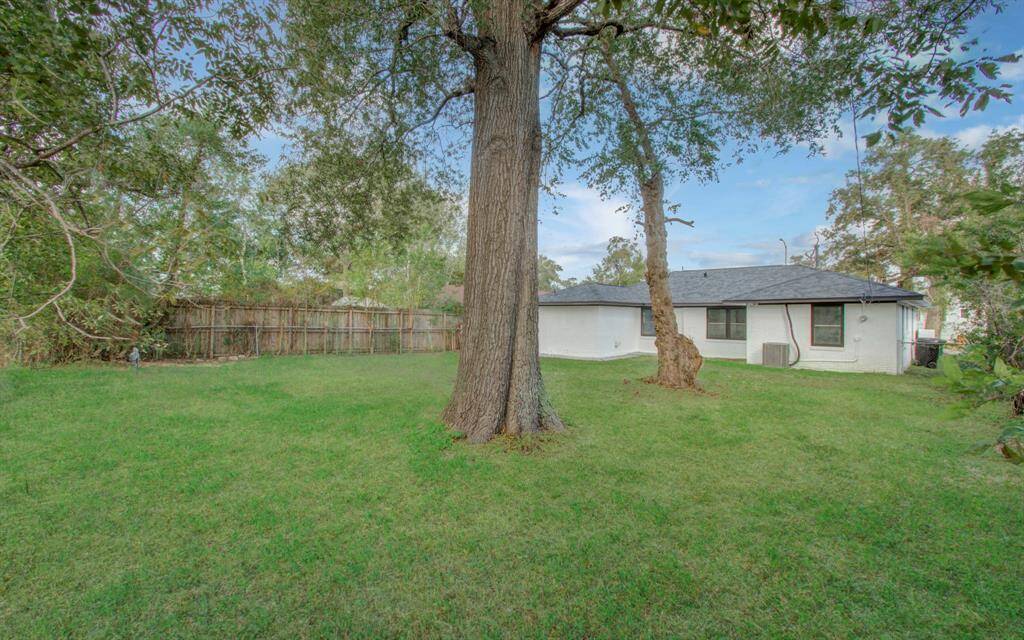 Spacious backyard with a neatly landscaped lawn and ample room for outdoor entertaining