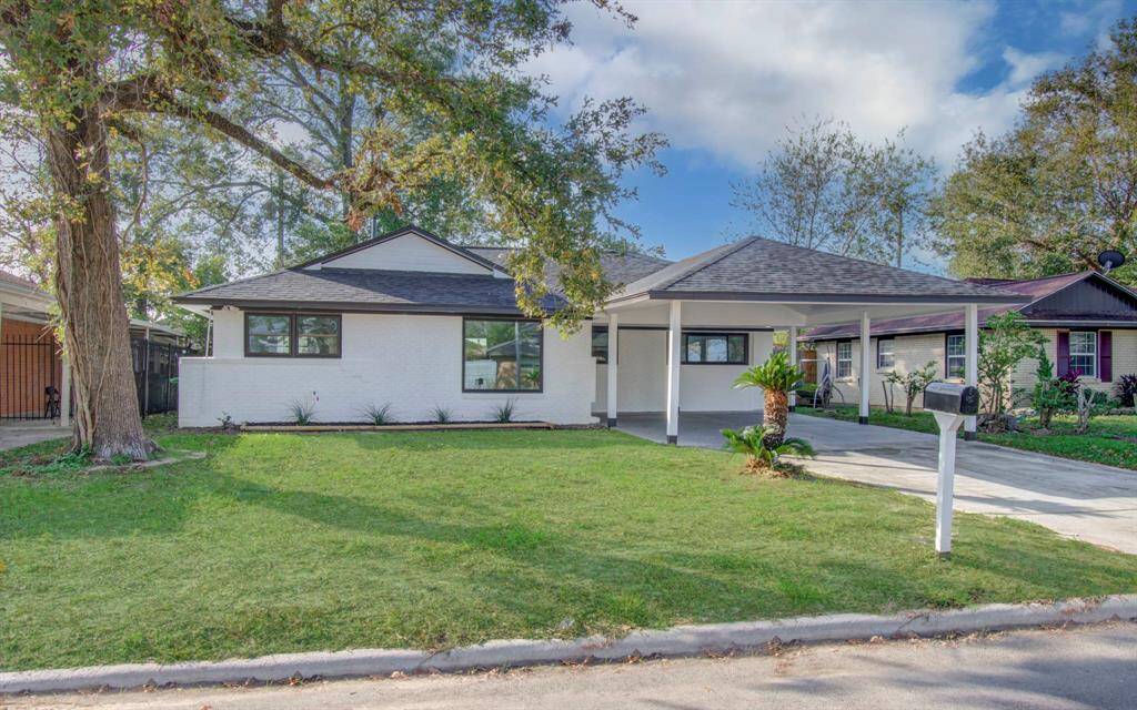 Inviting front view with a modern facade, landscaped yard, and excellent curb appeal