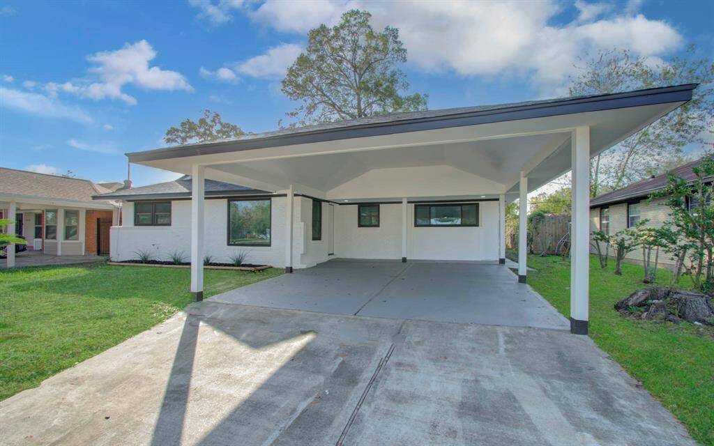 Front view featuring a spacious carport