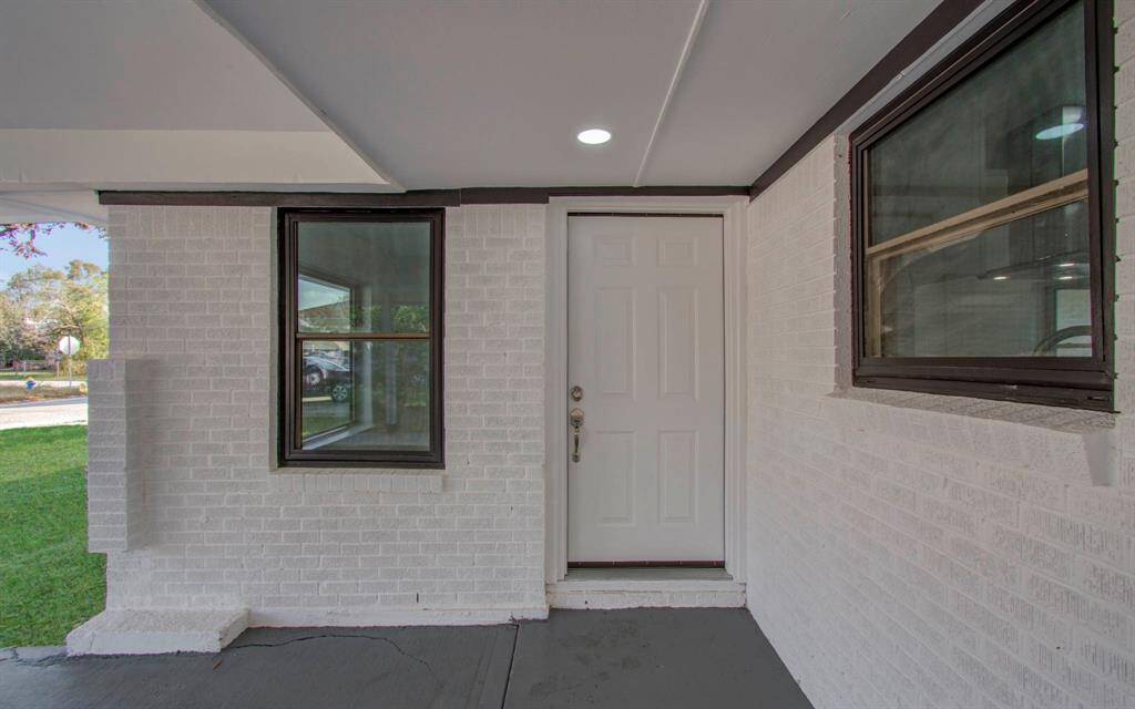 Front view highlighting the main entrance with a stylish door and welcoming design
