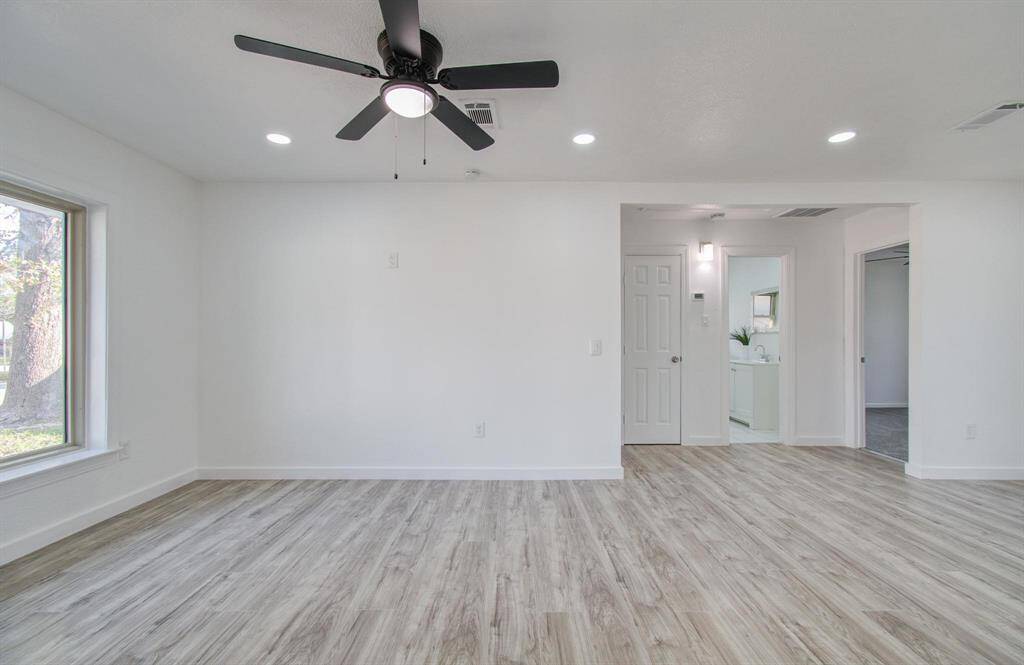Spacious open-concept living room with seamless flow, modern finishes, and abundant natural light.