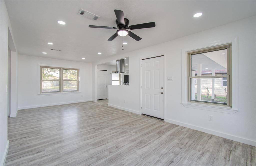 Spacious open-concept living room with seamless flow, modern finishes, and abundant natural light.