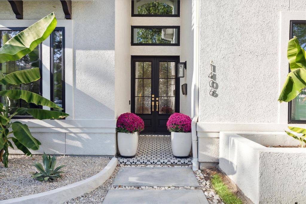 Double entry doors and tile covered front porch are welcoming here at Sue Barnett!