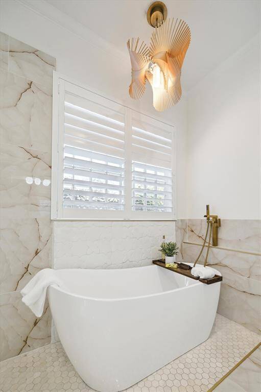 The home has gorgeous stone, tilework, lighting and fixtures!