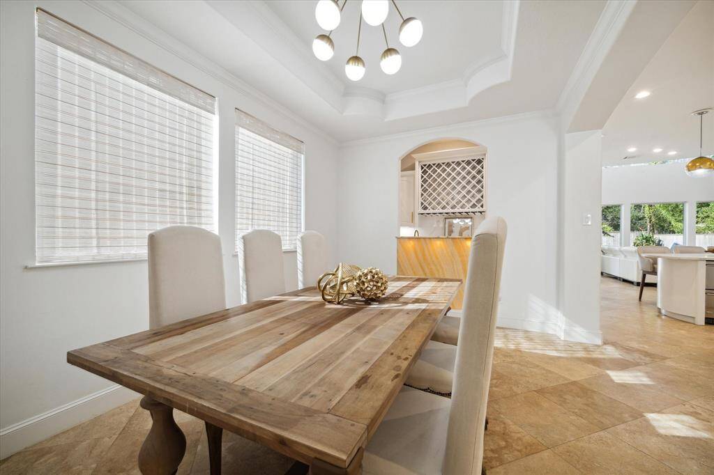 The open floor plan nicely accommodates grand-scale dining and entertaining.