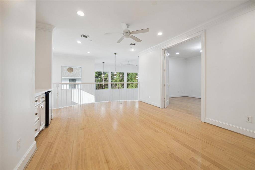 Second floor gameroom with built-ins and beverage fridge - with Juliet balcony overlooking the great room.  Private balcony access.